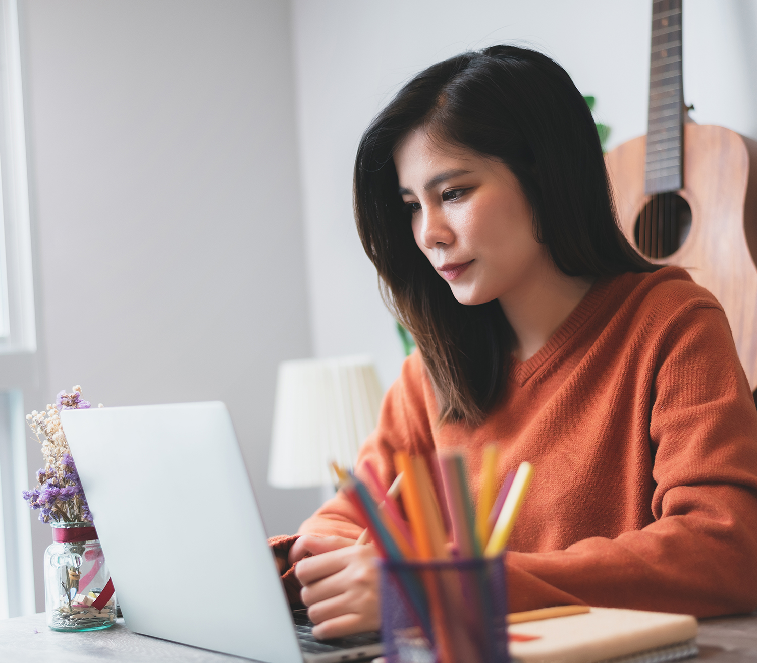 Beautiful Asian Young Woman Creative Freelancer Working on Lapto